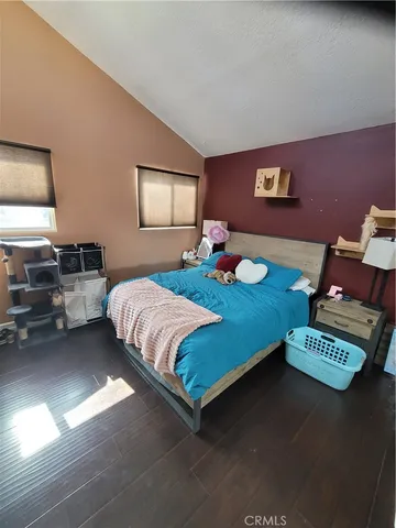 a bedroom with a bed and dresser
