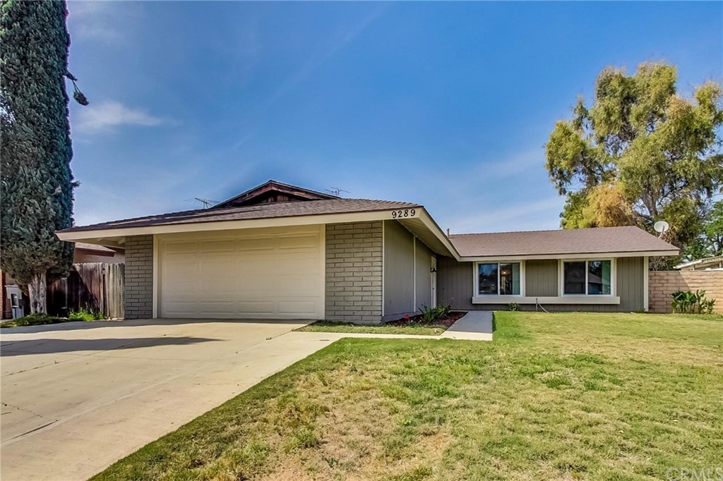 9289 Delano Drive Riverside, CA 92503 - Photo 1 of 1 a front view of a house with a yard and garage