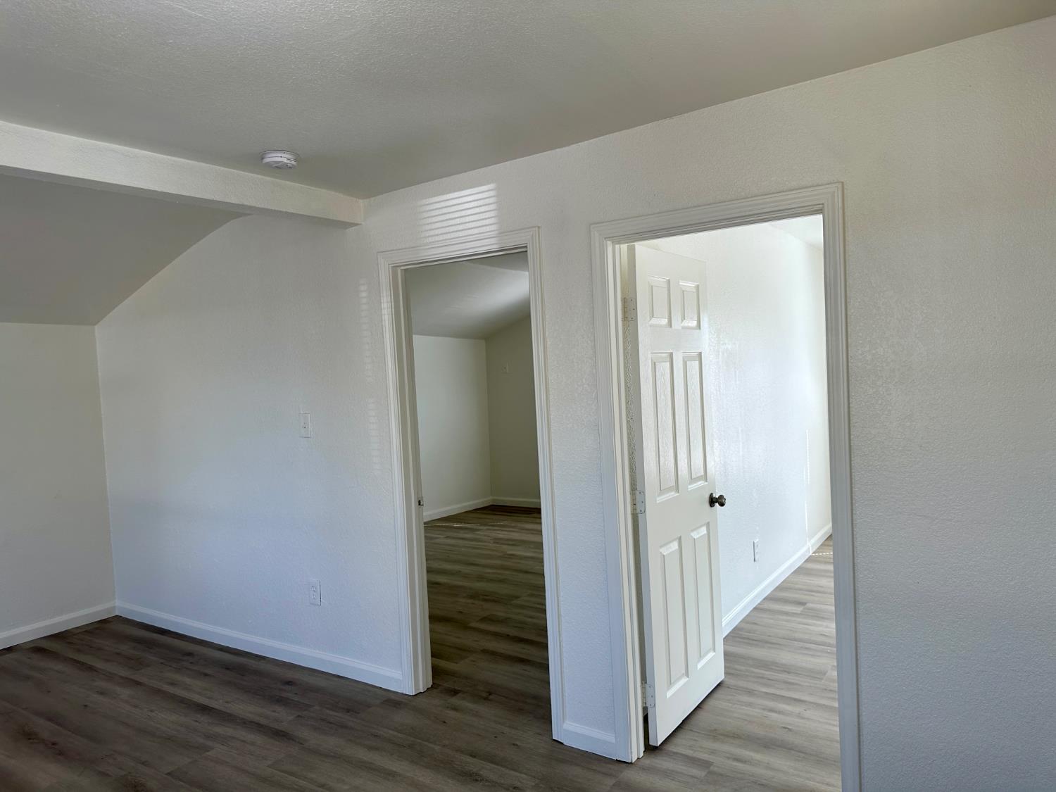 809 Washington Avenue Madera, CA 93638 - Photo 9 of 20 a view of a hallway with wooden floor