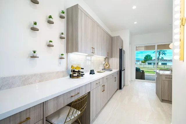 a utility room with sink dryer and washer