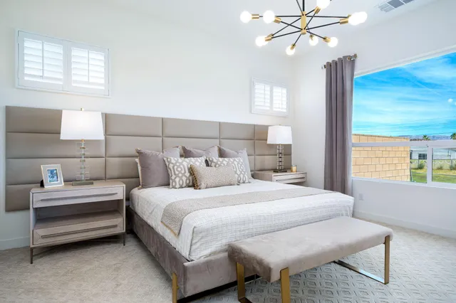 a living room with furniture and a lamp