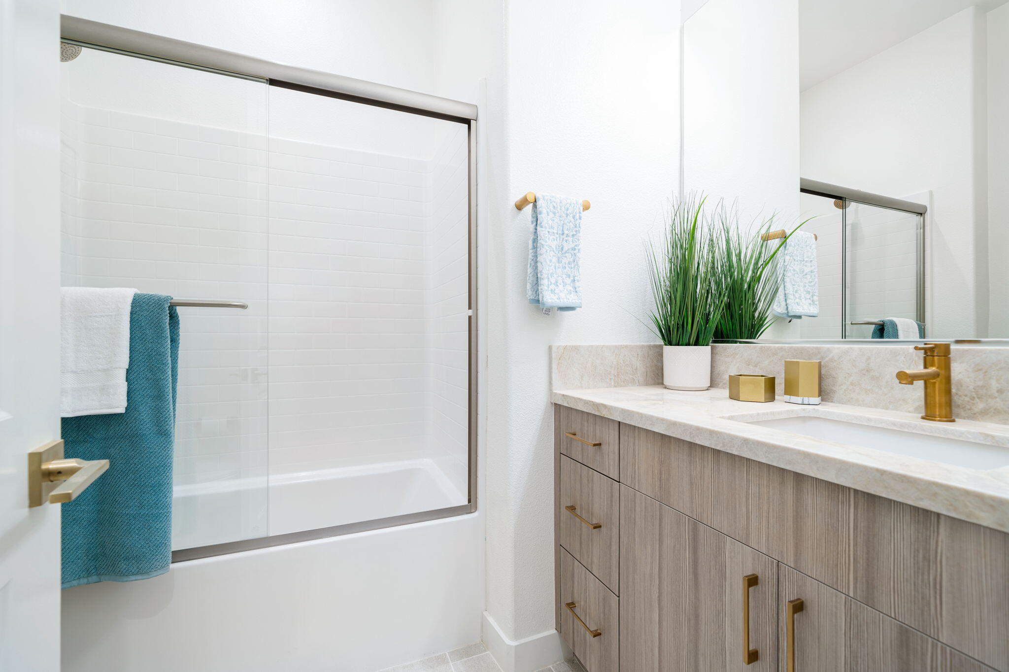 82725 Ryan Way Indio, CA 92201 - Photo 23 of 31 a bathroom with a sink a mirror and a shower