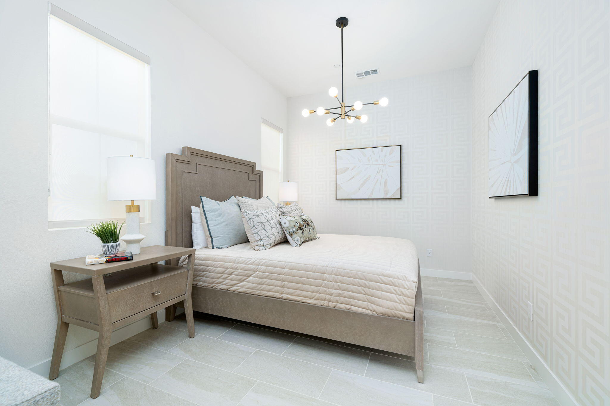 82725 Ryan Way Indio, CA 92201 - Photo 29 of 31 a bedroom with a bed chandelier and a window