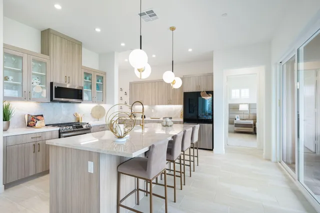 a kitchen with a sink stove and microwave
