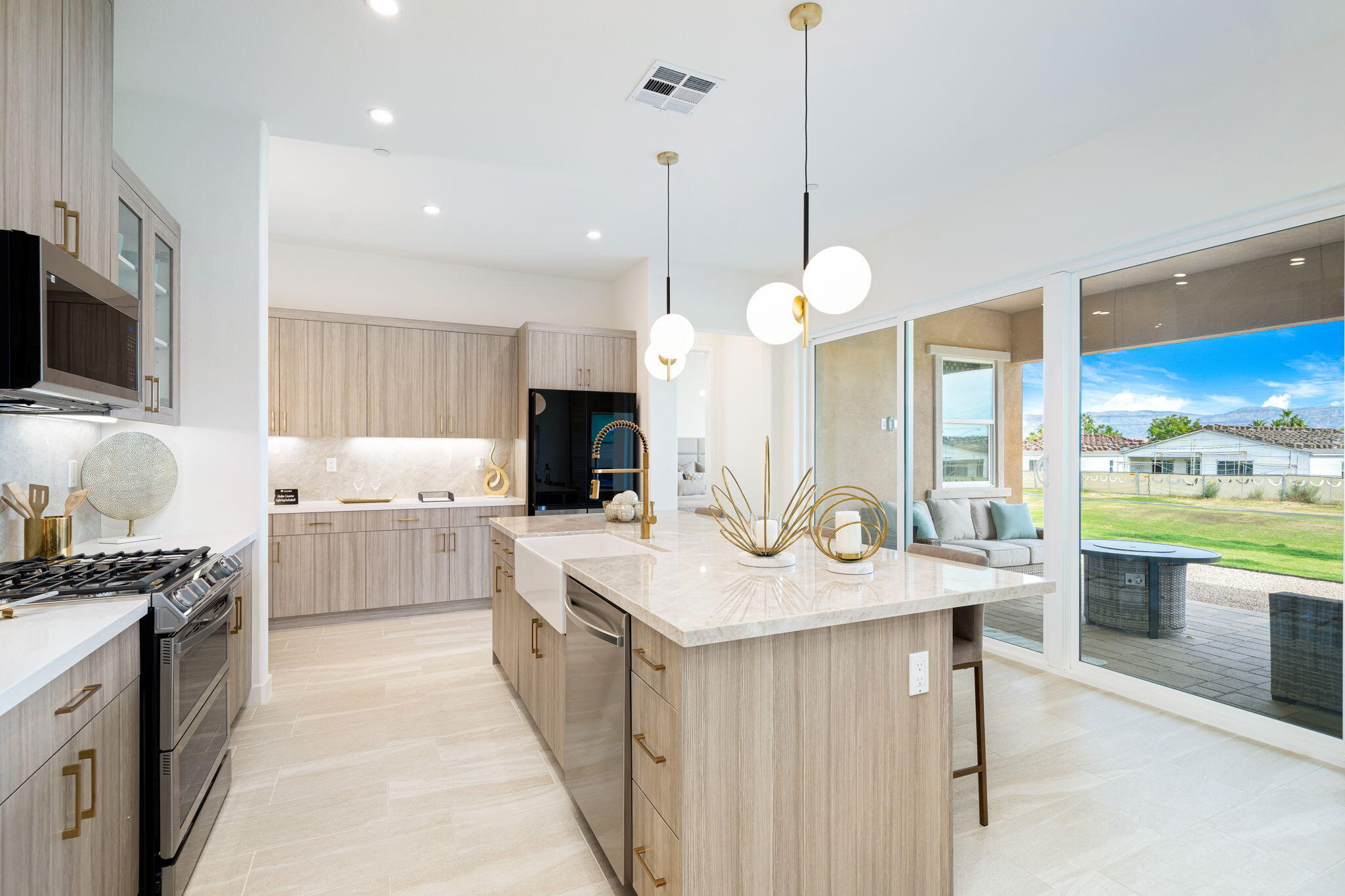 82725 Ryan Way Indio, CA 92201 - Photo 8 of 31 a kitchen with a sink stove and microwave