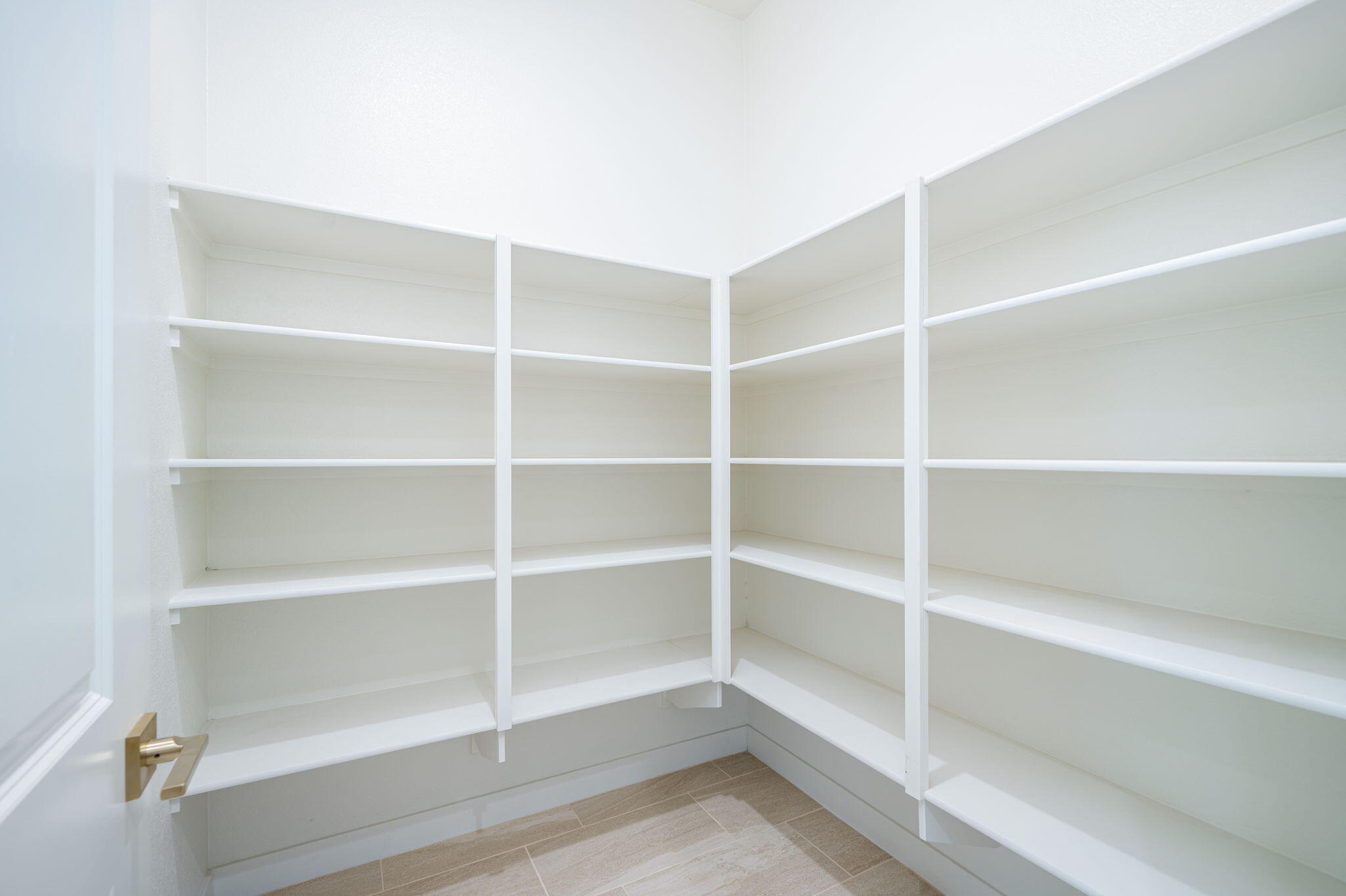 82725 Ryan Way Indio, CA 92201 - Photo 10 of 31 a view of walk in closet with empty racks
