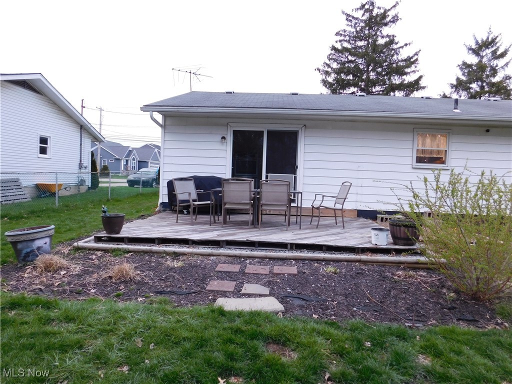 8754 Root Road North Ridgeville, OH 44039 - Photo 37 of 39 Rear view of house featuring a yard, a deck, and fence