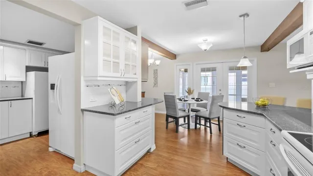 a living room with granite countertop furniture and a dining table