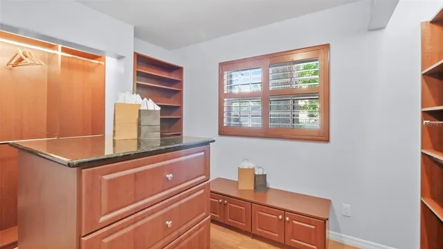 a kitchen with stainless steel appliances granite countertop a sink and a cabinets