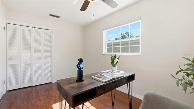 a workspace with furniture and wooden floor