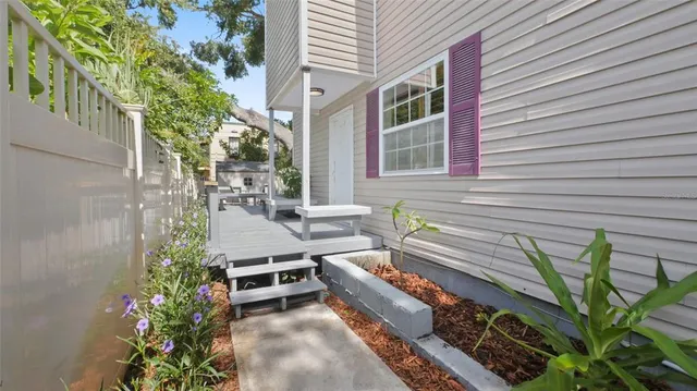 a view of a chairs and table on the wooden deck