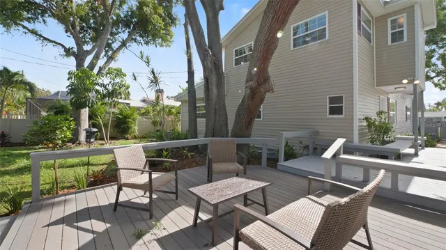 a view of a house with yard and a garden