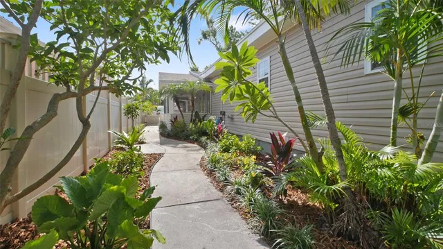 an aerial view of a house with a yard and garden
