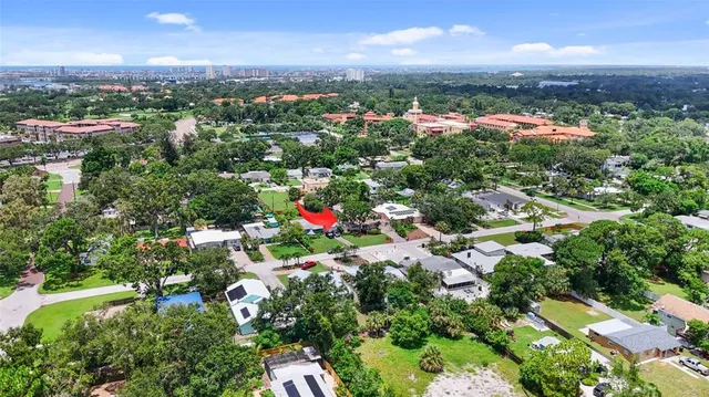 a front view of a house with a yard and porch