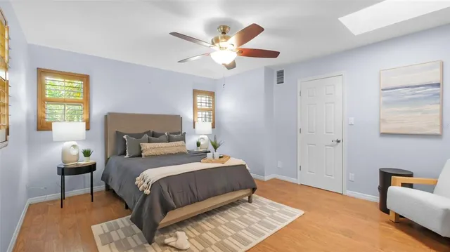 a bedroom with a bed and window