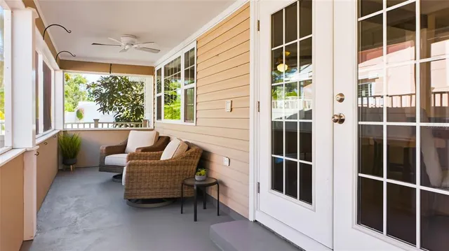 a balcony with furniture and a window