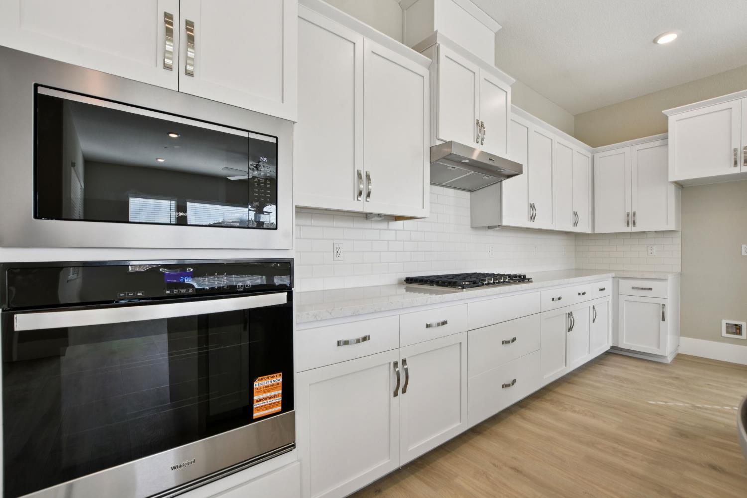 3016 Pocosol Way Rancho Cordova, CA 95742 - Photo 11 of 37 a kitchen with stainless steel appliances white cabinets and stove