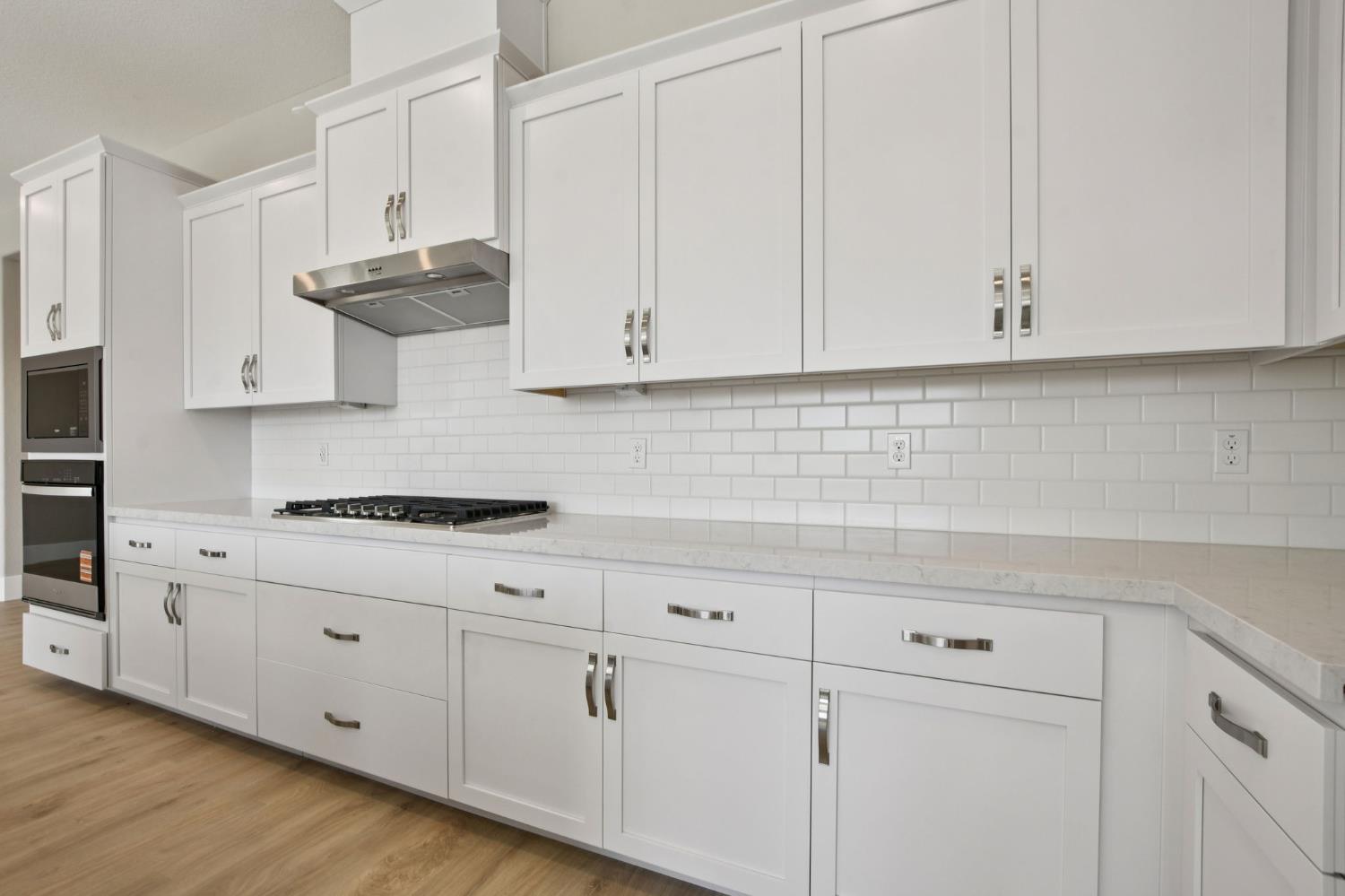 3016 Pocosol Way Rancho Cordova, CA 95742 - Photo 13 of 37 a kitchen with white cabinets and white appliances