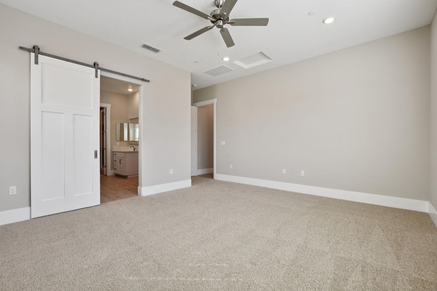 3016 Pocosol Way Rancho Cordova, CA 95742 - Photo 20 of 37 an empty room with closet and a ceiling fan