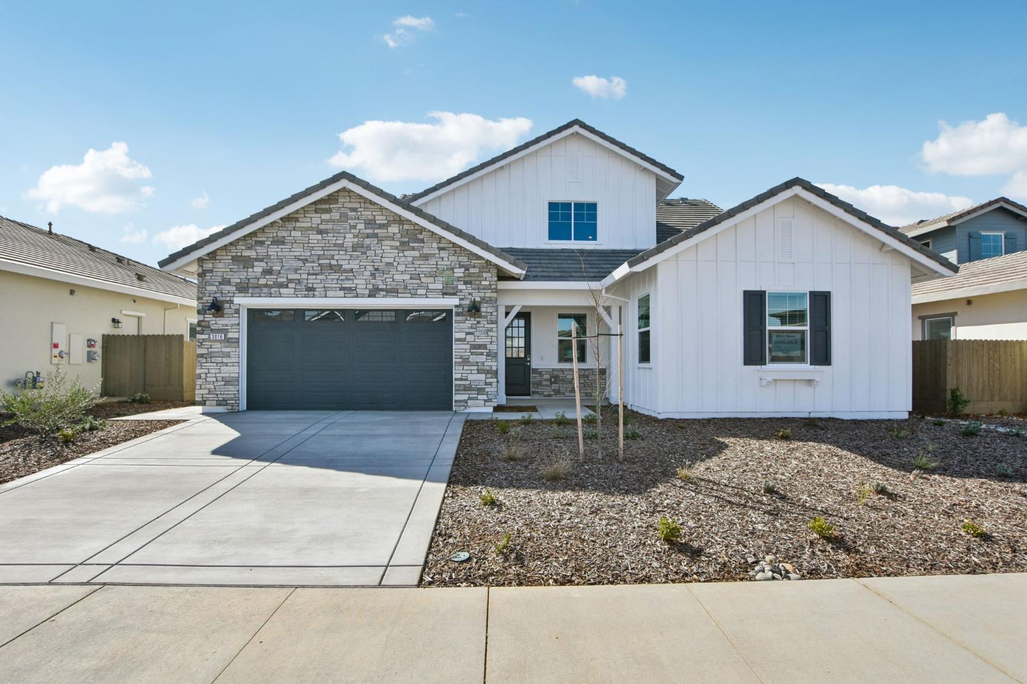 3016 Pocosol Way Rancho Cordova, CA 95742 - Photo 2 of 37 a front view of a house with a yard and garage
