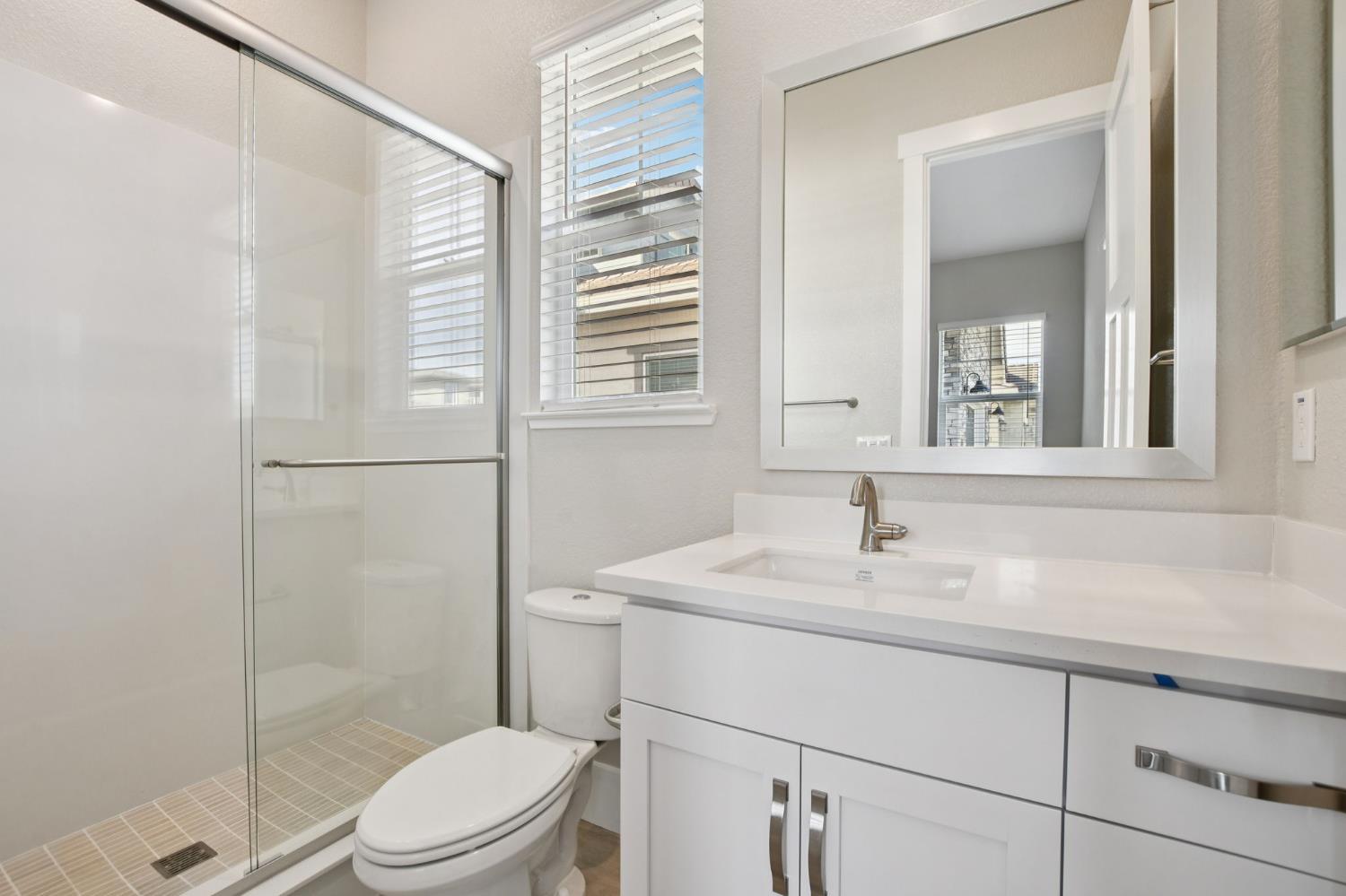 3016 Pocosol Way Rancho Cordova, CA 95742 - Photo 26 of 37 a bathroom with a sink toilet and shower