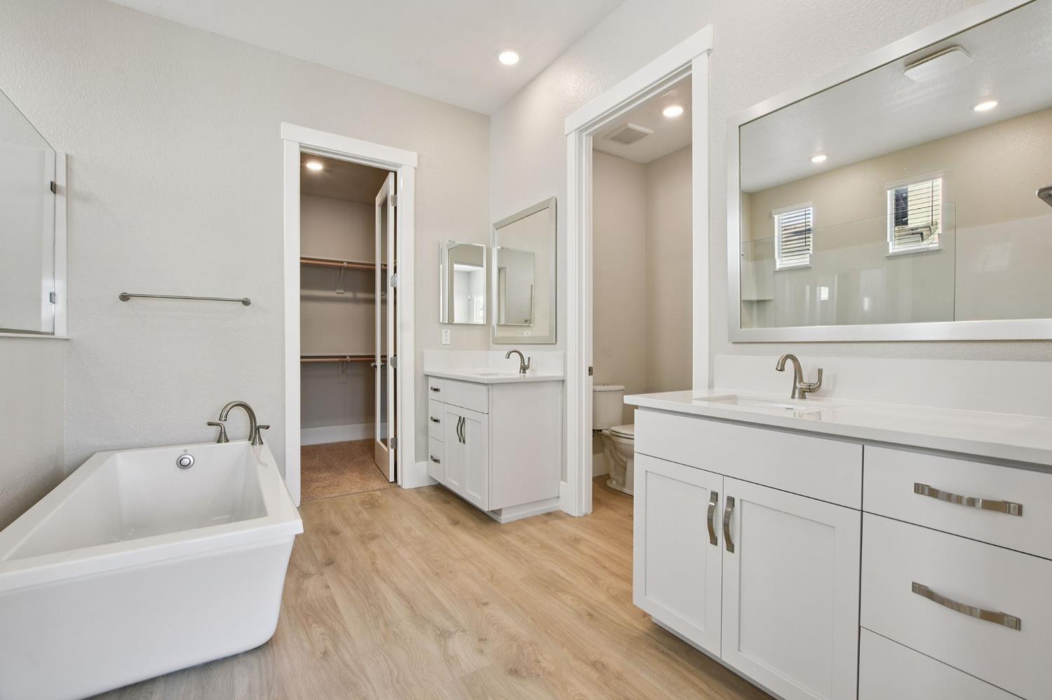 3016 Pocosol Way Rancho Cordova, CA 95742 - Photo 29 of 37 a spacious bathroom with a tub sink and mirror