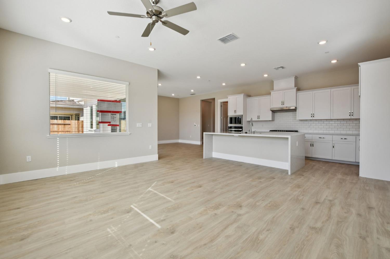 3016 Pocosol Way Rancho Cordova, CA 95742 - Photo 9 of 37 a view of kitchen with kitchen island wooden cabinets and refrigerator