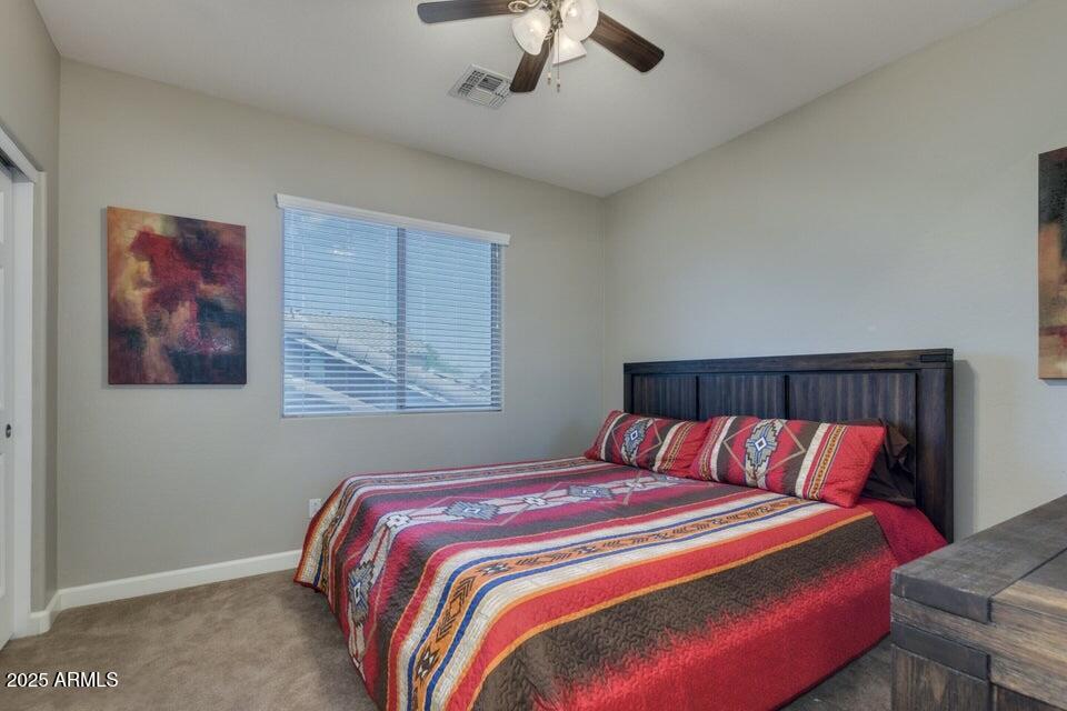 46073 West Morning View Lane Maricopa, AZ 85139 - Photo 20 of 36 a bedroom with bed and window