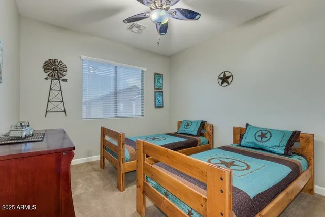 a bedroom with a bed and a table