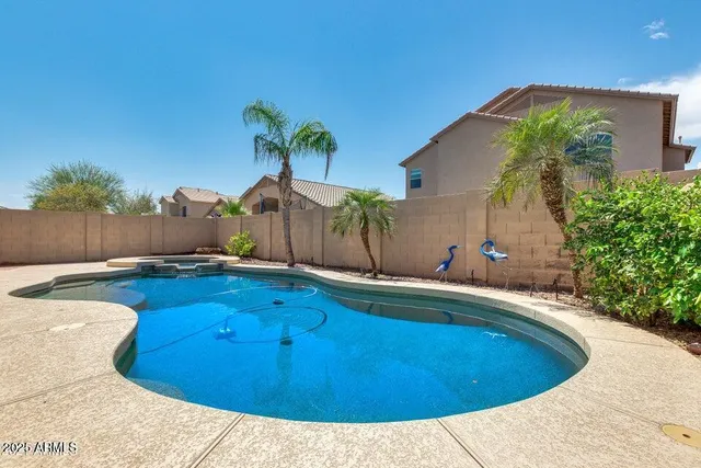 a swimming pool with yard