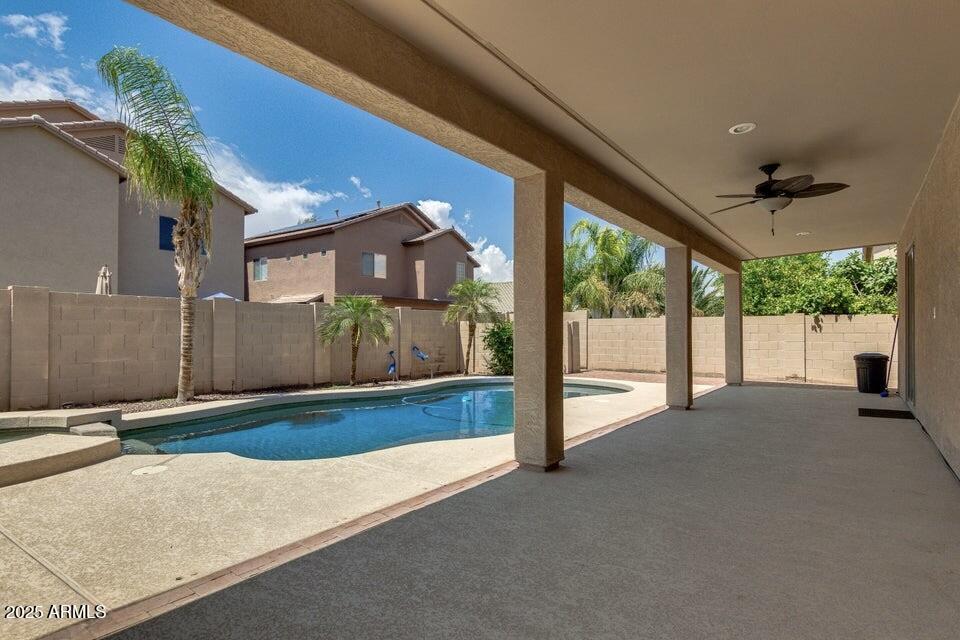 46073 West Morning View Lane Maricopa, AZ 85139 - Photo 29 of 36 a view of a house with backyard and porch