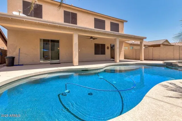 a view of a swimming pool with an ocean view