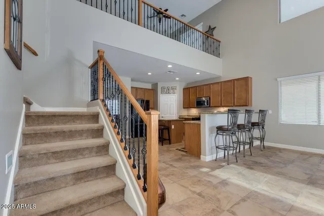 a view of a hallway with seating and lots of furniture