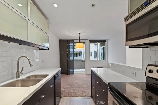 a spacious bedroom with a bed and a couch