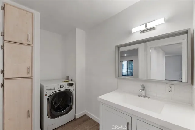 a front view of a house with a garden and plants