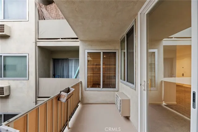 a view of an apartment with furniture and a kitchen