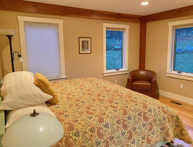 469 Boulger Road Stamford, VT 05352 - Photo 13 of 37 a bedroom with a bed and painting on the wall