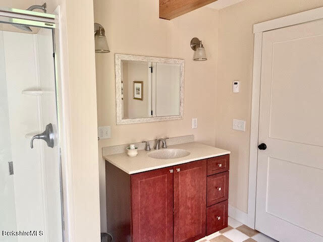 469 Boulger Road Stamford, VT 05352 - Photo 15 of 37 a bathroom with a sink and mirror