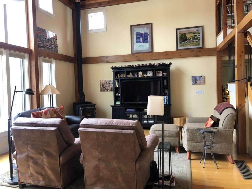 469 Boulger Road Stamford, VT 05352 - Photo 4 of 37 a living room with furniture and a fireplace