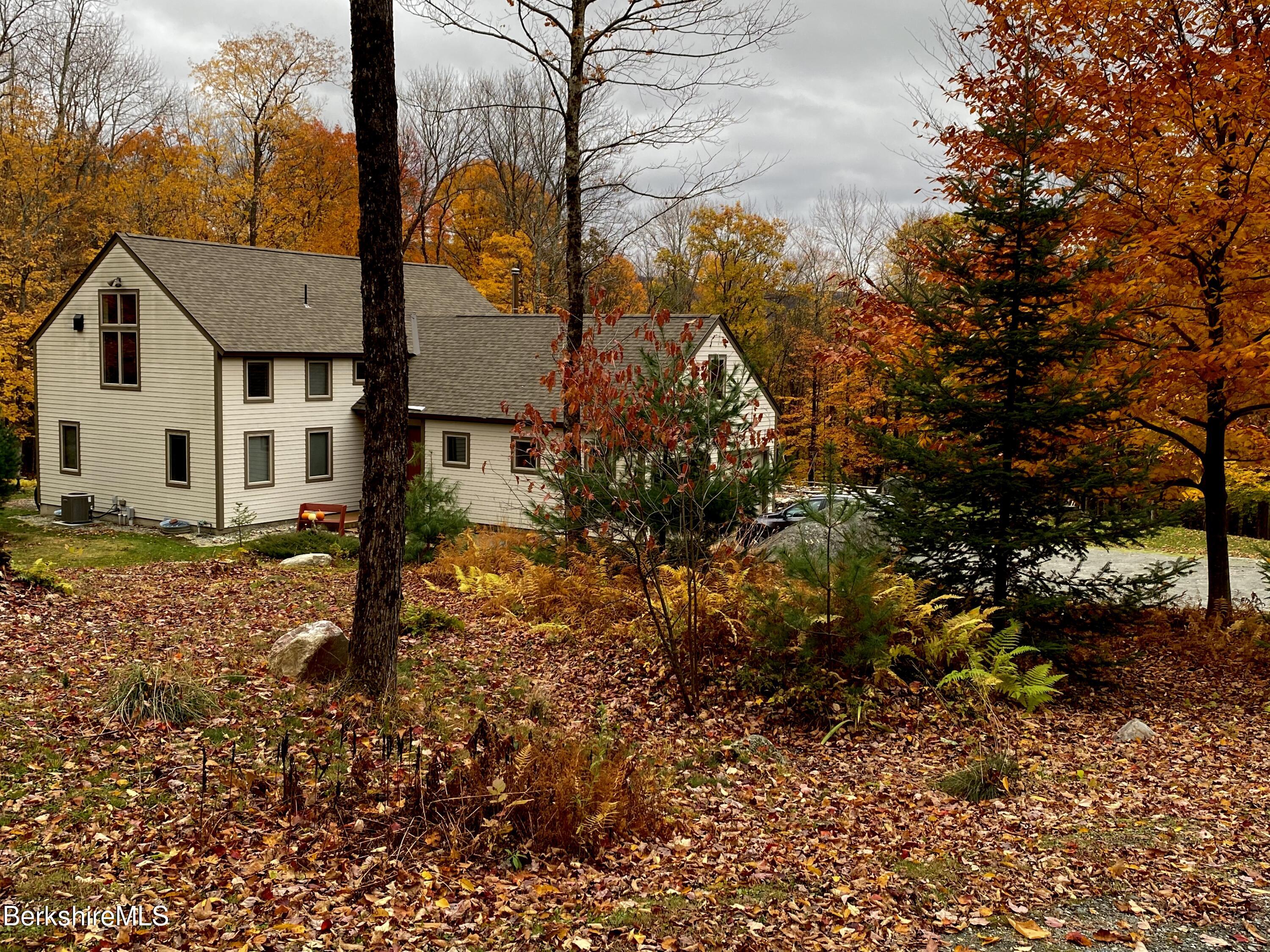 469 Boulger Road Stamford, VT 05352 - Photo 32 of 37 a view of a house with a tree in the background
