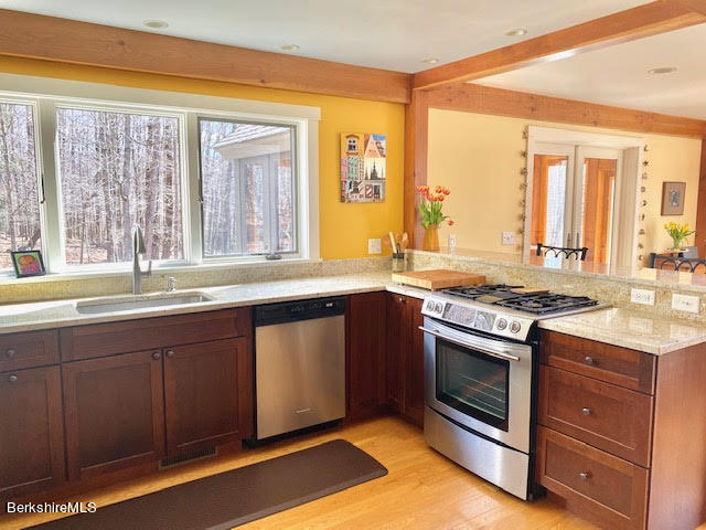 469 Boulger Road Stamford, VT 05352 - Photo 5 of 37 a kitchen with stainless steel appliances granite countertop a stove and a sink