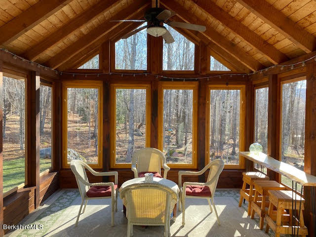 469 Boulger Road Stamford, VT 05352 - Photo 9 of 37 a living room with furniture and floor to ceiling windows