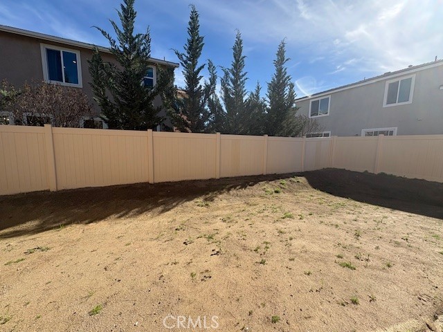 30495 Servin Lane Menifee, CA 92584 - Photo 13 of 22 a view of a yard covered in snow
