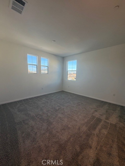 30495 Servin Lane Menifee, CA 92584 - Photo 16 of 22 a view of an empty room with windows