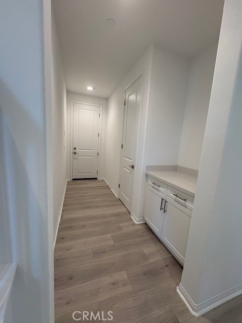 30495 Servin Lane Menifee, CA 92584 - Photo 3 of 22 a view of a hallway with storage
