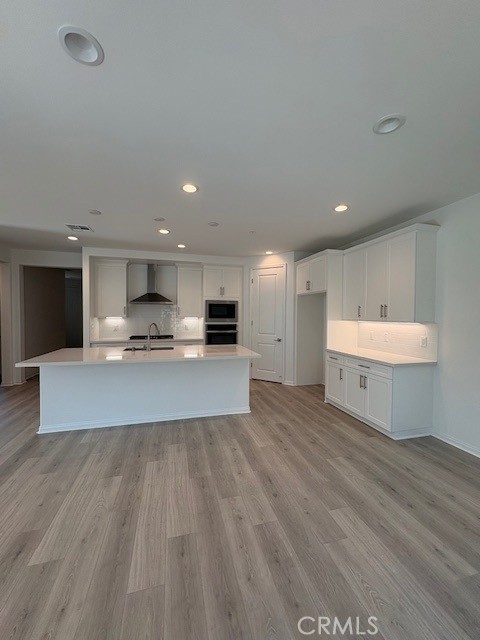 30495 Servin Lane Menifee, CA 92584 - Photo 9 of 22 a large room with kitchen view and a sink