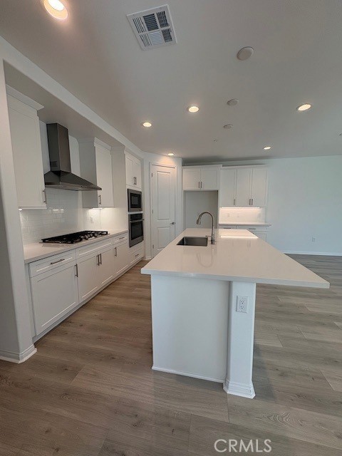 30495 Servin Lane Menifee, CA 92584 - Photo 10 of 22 a view of kitchen with stainless steel appliances cabinets