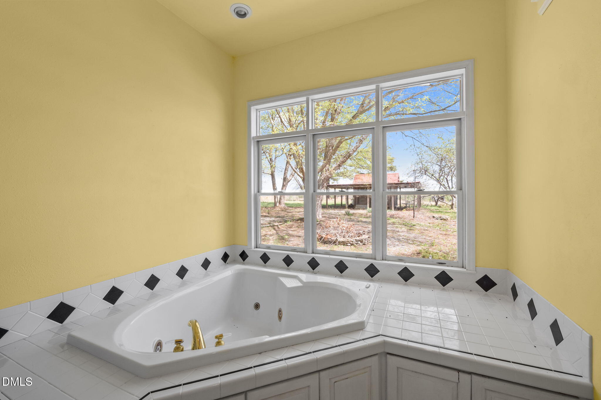 212 Thomas Humphries Road Roxboro, NC 27574 - Photo 28 of 56 a bath tub sitting next to a window