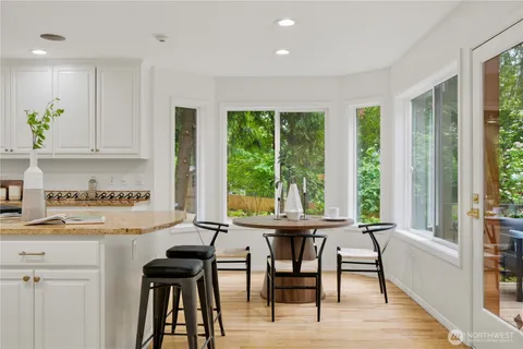a view of a dining room with furniture window and outside view