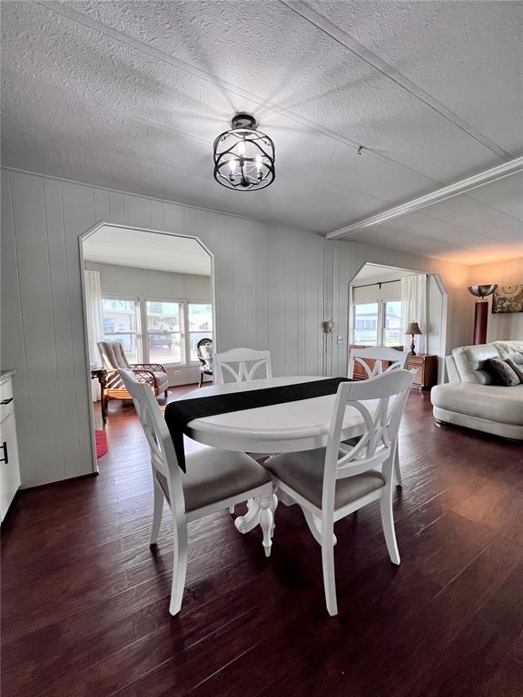 1100 South Belcher Road, Unit 772 Largo, FL 33771 - Photo 12 of 84 a dining room with a wooden table and chairs